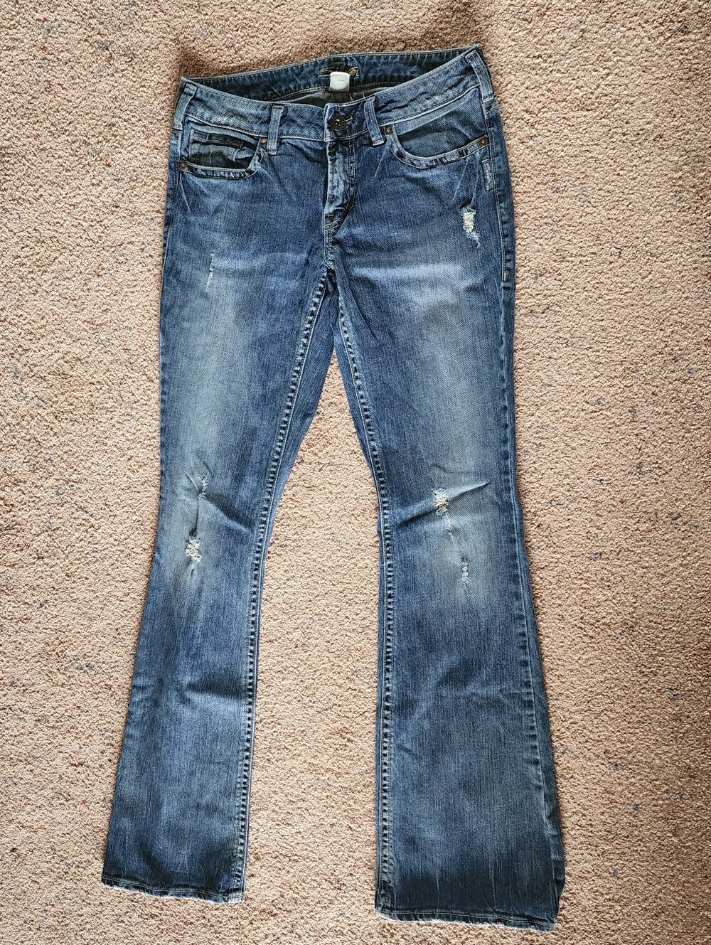 Silver Jeans Women's Blue Flare Jeans with Distressed Detail
